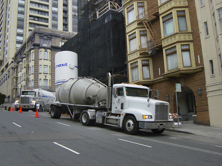 Freightliner pulling Air Cans hauling roof gravel