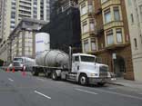 Freightliner pulling Air Cans hauling roof gravel